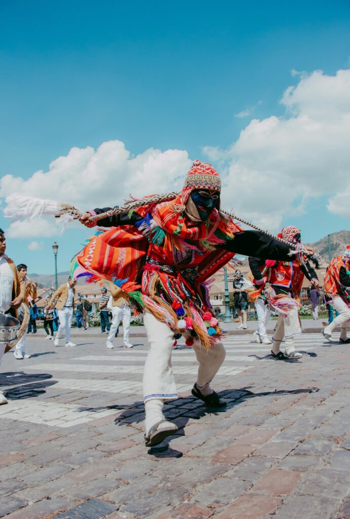 Colorful traditional dancers in Cusco, Peru, celebrating cultural heritage with vibrant costumes.