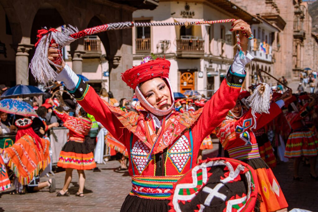 Colorful traditional dance performance during a vibrant cultural festival in Cusco, Peru.