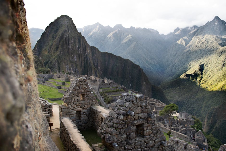 Explore the ancient Incan ruins of Machu Picchu nestled in Peru's breathtaking Andes mountains.
