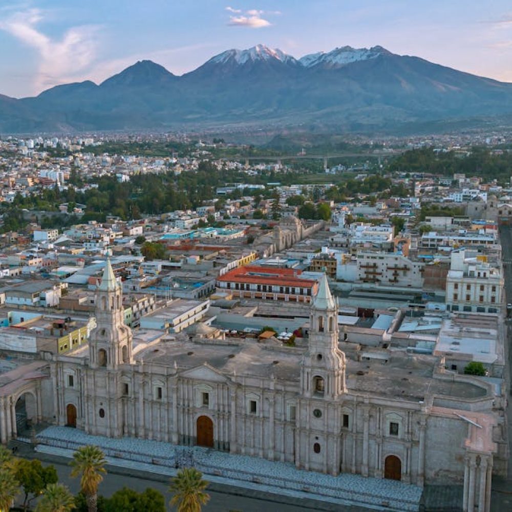 Stunning aerial view of Arequipa with majestic cathedral and Andean mountains in Peru.