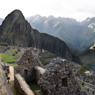 Explore the ancient Incan ruins of Machu Picchu nestled in Peru's breathtaking Andes mountains.